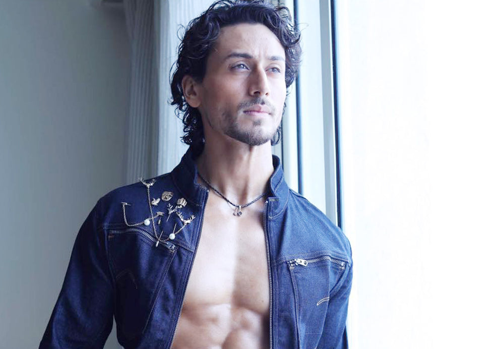 Action star Tiger Shroff shines perfectly while adorning our beautiful range of lapel pins all over his denim jacket